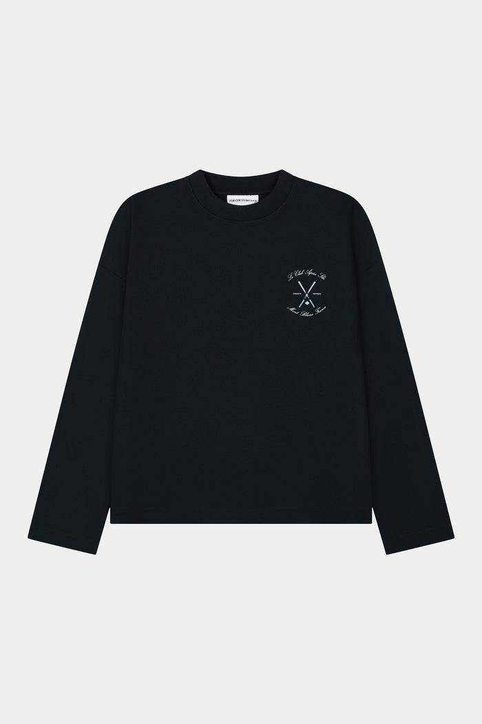 Black long-sleeve t-shirt with a small graphic on a light grey background