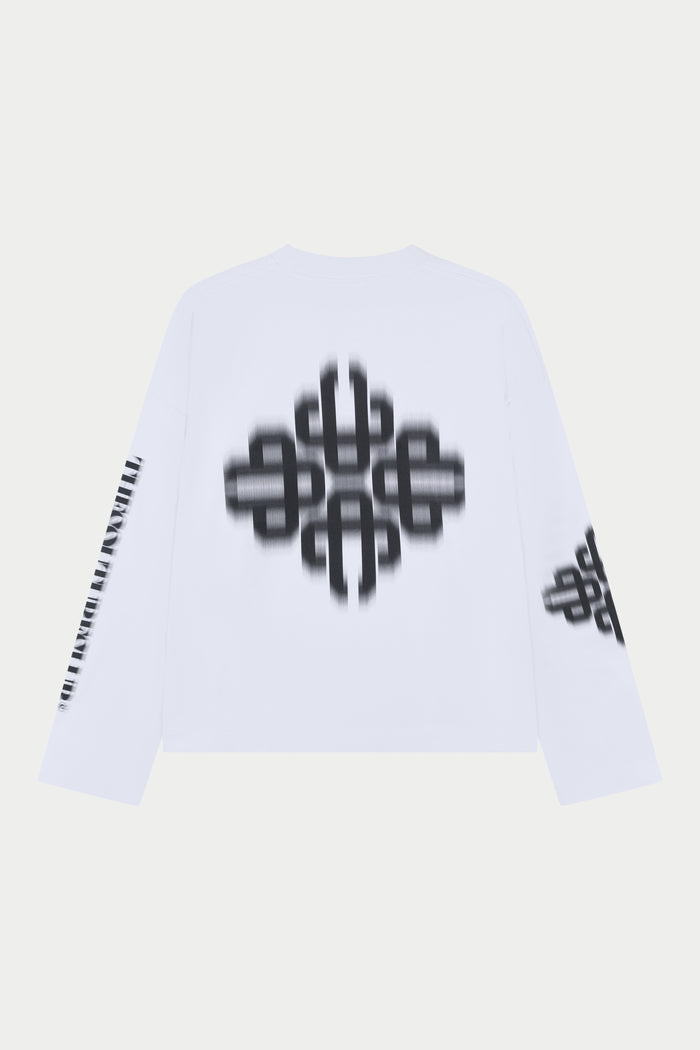White long sleeved t-shirt with black geometric patterns on a light grey background