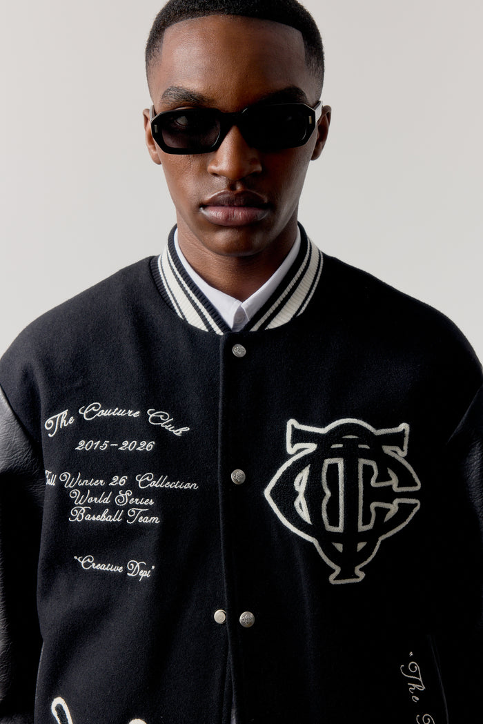MULTI BADGE VARSITY JACKET - BLACK