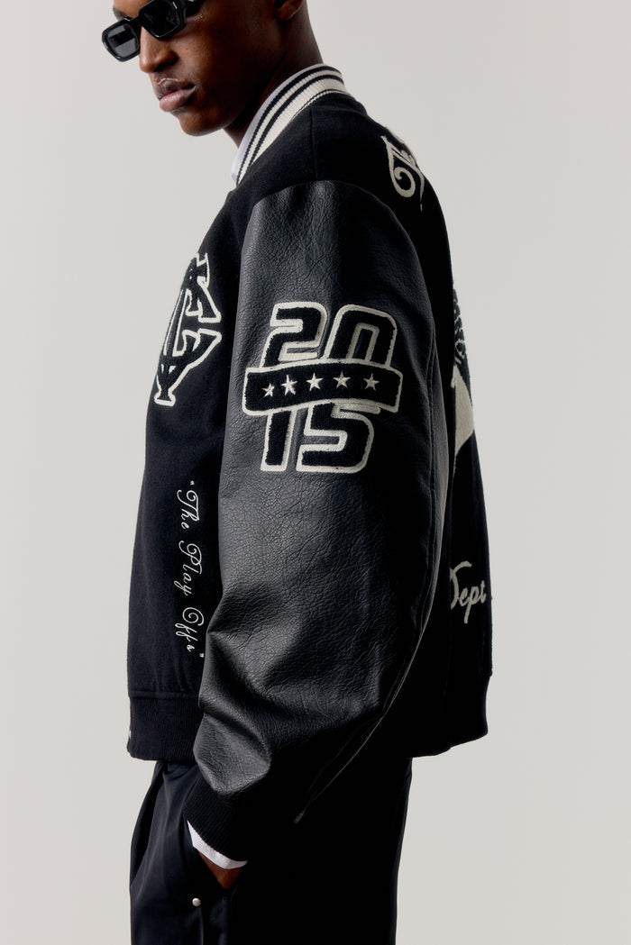 MULTI BADGE VARSITY JACKET - BLACK