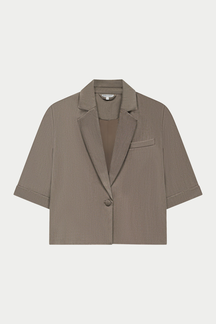 Beige blazer on a white background