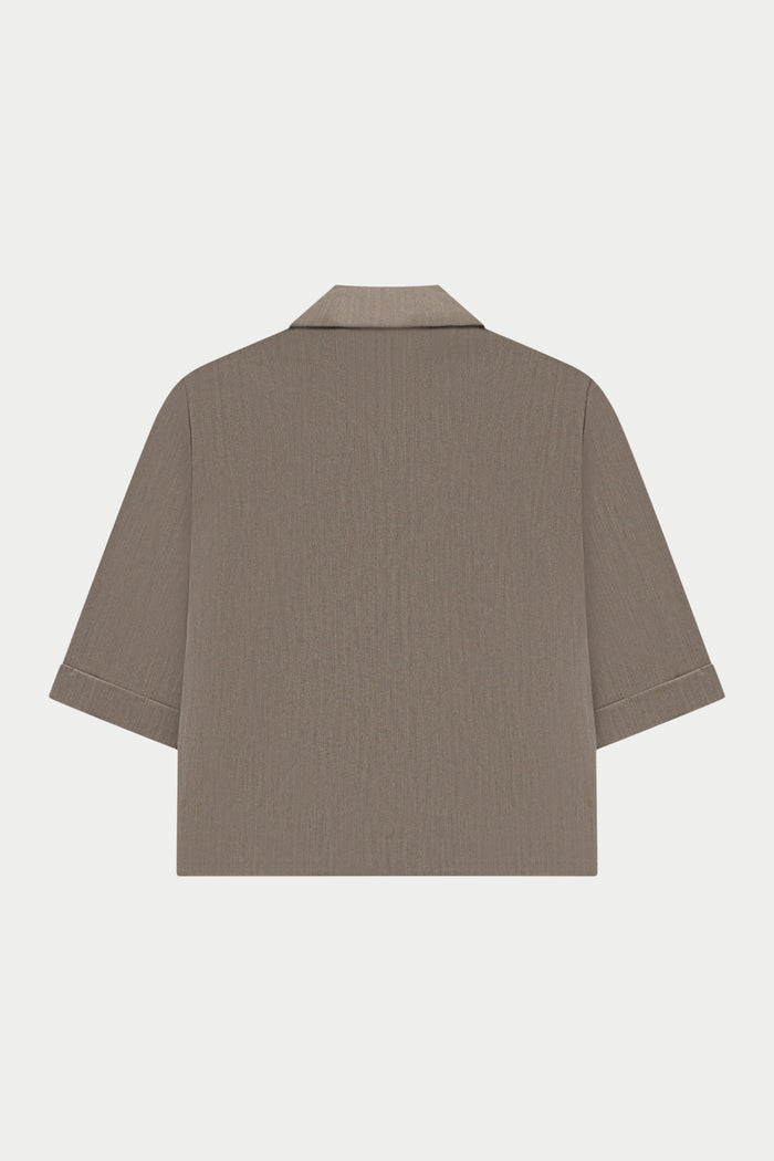 Beige blazer on a white background